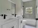 Clean bathroom with shower/tub combo and white vanity at 556 Marion Oaks Pass, Ocala, FL 34473