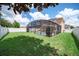Large backyard with a screened pool and fenced perimeter at 11932 Old Glory Dr, Orlando, FL 32837