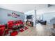 Spacious living room with red and brown couches and open floor plan at 11932 Old Glory Dr, Orlando, FL 32837