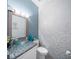 Powder room with glass sink, granite countertop, and mosaic tile at 11932 Old Glory Dr, Orlando, FL 32837