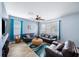 Living room with brown couches, coffee table, and teal rug at 11932 Old Glory Dr, Orlando, FL 32837