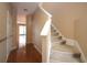 Carpeted staircase and hardwood hallway at 614 Pinebranch Cir, Winter Springs, FL 32708