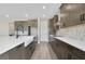 Modern kitchen with farmhouse sink and gray cabinets at 492 Toscano St, Clermont, FL 34715