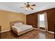 Main bedroom with wood flooring and ceiling fan at 70 Jett Loop, Apopka, FL 32712