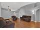 Relaxing living room featuring hardwood floors and comfortable seating at 70 Jett Loop, Apopka, FL 32712