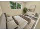 Spacious bedroom with new carpet and large window at 619 Saint Lucie Ln, Orlando, FL 32807