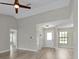 Open living area with new flooring and neutral paint at 607 Polynesian Ct, Kissimmee, FL 34758