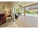Spacious lanai with pool access, seating area, and screened enclosure at 4423 Nottoway Dr, Leesburg, FL 34748