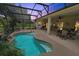 Inviting pool area with a covered patio and comfortable seating at 4423 Nottoway Dr, Leesburg, FL 34748