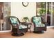 Relaxing patio with wicker chairs and side table, perfect for outdoor enjoyment at 4423 Nottoway Dr, Leesburg, FL 34748