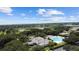 Community overview featuring pool, clubhouse, and tennis courts at 4423 Nottoway Dr, Leesburg, FL 34748