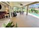 Relaxing lanai with pool access, outdoor seating and a screened enclosure at 4423 Nottoway Dr, Leesburg, FL 34748
