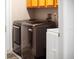 Laundry room with modern washer and dryer at 4423 Nottoway Dr, Leesburg, FL 34748