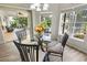 Bright dining area with glass table and view of backyard pool at 4423 Nottoway Dr, Leesburg, FL 34748