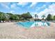 Stunning resort-style pool with brick pavers and lounge chairs at 4423 Nottoway Dr, Leesburg, FL 34748