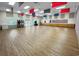 Spacious community room with hardwood floors, perfect for events at 4423 Nottoway Dr, Leesburg, FL 34748