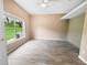 Bright bedroom with large window and vinyl plank flooring at 4423 Nottoway Dr, Leesburg, FL 34748