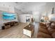 Bright living room with high ceilings, hardwood floors and lots of natural light at 4423 Nottoway Dr, Leesburg, FL 34748