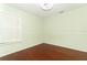 Well-lit bedroom with hardwood floors and a mirrored closet at 613 Tradewinds Dr, Deltona, FL 32738