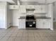 Modern kitchen with white cabinets and granite countertops at 6516 Viewpoint Ct, Orlando, FL 32810