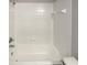 Simple bathroom with a shower/tub and tile surround at 6516 Viewpoint Ct, Orlando, FL 32810