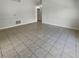Bright living room with tile floors and access to other rooms at 6516 Viewpoint Ct, Orlando, FL 32810