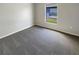 Well-lit bedroom featuring carpet flooring and a large window at 6516 Viewpoint Ct, Orlando, FL 32810