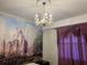 Bedroom with a mural of Cinderella's Castle and a crystal chandelier at 3141 Paradox Cir # 306, Kissimmee, FL 34746