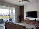 Living room with lake view, flat-screen TV, and comfortable seating at 3141 Paradox Cir # 306, Kissimmee, FL 34746