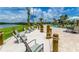Beach entry pool with lounge chairs and a gazebo at 3141 Paradox Cir # 306, Kissimmee, FL 34746