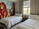 Bedroom with Lion King mural, double and single beds, and nightstand at 3141 Paradox Cir # 306, Kissimmee, FL 34746