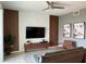 Living room with wood accent wall, flat-screen TV, and comfortable seating at 3141 Paradox Cir # 306, Kissimmee, FL 34746