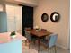 Dining area with wood table and gray chairs at 3141 Paradox Cir # 306, Kissimmee, FL 34746