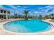 Large resort-style pool with plenty of lounge chairs at 3141 Paradox Cir # 306, Kissimmee, FL 34746