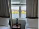 Bedroom with lake view from window between twin beds at 3141 Paradox Cir # 306, Kissimmee, FL 34746