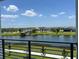 View of lake, community amenities, and houses at 3141 Paradox Cir # 306, Kissimmee, FL 34746