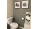 Simple bathroom with toilet and gray wall at 3141 Paradox Cir # 306, Kissimmee, FL 34746