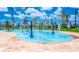 Interactive splash pad with colorful water features at 3141 Paradox Cir # 306, Kissimmee, FL 34746