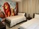 Bedroom with Lion King mural, double and single beds, and nightstand at 3141 Paradox Cir # 306, Kissimmee, FL 34746
