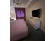 Main bedroom with a dresser and large TV at 3141 Paradox Cir # 306, Kissimmee, FL 34746