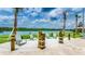 Relaxing lakefront seating area with wooden posts at 3141 Paradox Cir # 306, Kissimmee, FL 34746