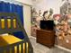 Bedroom with Toy Story mural, bunk beds, and dresser at 3141 Paradox Cir # 306, Kissimmee, FL 34746