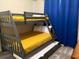 Bunk beds in a bright bedroom with a yellow and gray color scheme at 3141 Paradox Cir # 306, Kissimmee, FL 34746