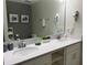 Double vanity bathroom with modern finishes and plenty of counter space at 3141 Paradox Cir # 306, Kissimmee, FL 34746