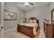 Guest bedroom with a queen-size bed and dresser at 12203 Pasha Ln, Orlando, FL 32827