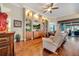 Comfortable living room with hardwood floors, built-in shelving and access to the patio at 12203 Pasha Ln, Orlando, FL 32827