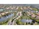 Gated community entrance with a lake and lush landscaping at 12203 Pasha Ln, Orlando, FL 32827