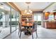 Charming dining area with hardwood floors and access to a screened patio at 12203 Pasha Ln, Orlando, FL 32827