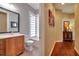 Bathroom with tub shower combo and wood vanity at 12203 Pasha Ln, Orlando, FL 32827