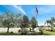 Quaint gazebo overlooking a lake and lush landscaping at 12203 Pasha Ln, Orlando, FL 32827